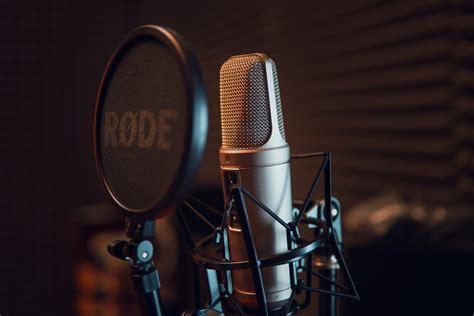 Silver Dynamic Microphone On Black Microphone Stand · Free Stock Photo
