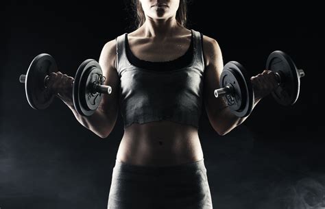 Sports Girl With Dumbbells In The Hands Of Wallpapers And Images Wallpapers Pictures Photos