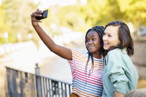 Two Multiethnic Female Friends Making Selfie Outdoors 4674761 Stock