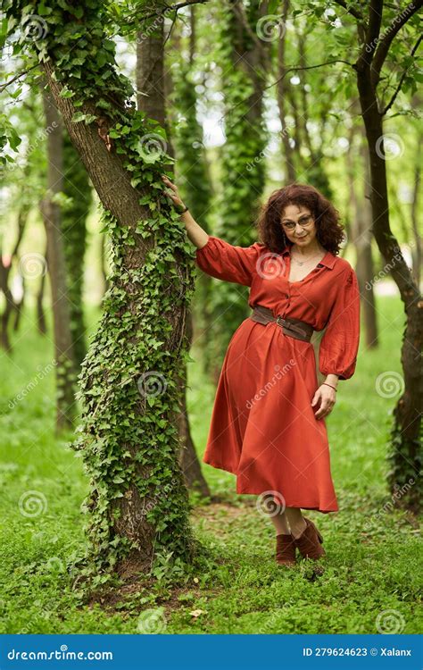 candid of a mature curly hair redhead woman stock image image of senior dress 279624623