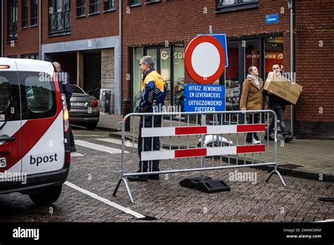 BAARLE-NASSAU - People with boxes of fireworks in the streets of the