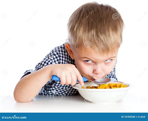 A Boy Is Eating Cereal From A Bowl Stock Photo Image Of Male Studio