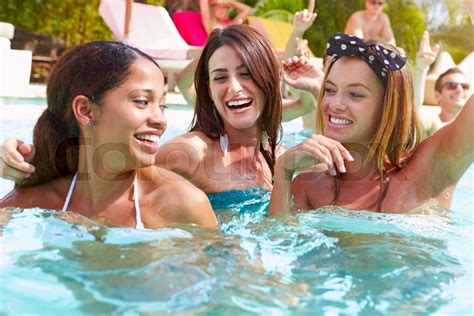 Three Women Having Fun In Swimming Pool Stock Image Colourbox