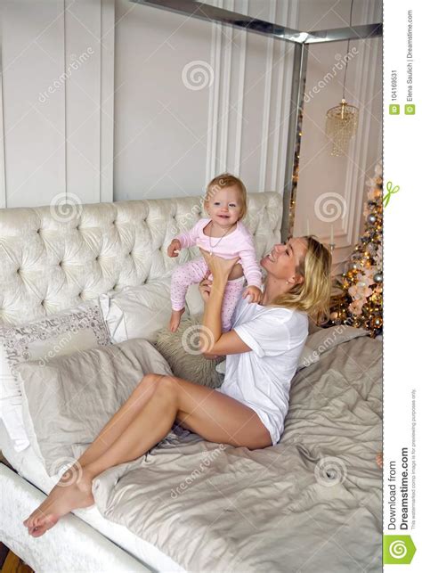 Mother Sitting With Her Daughter On The Big Bed Stock Image Image Of Nature Love