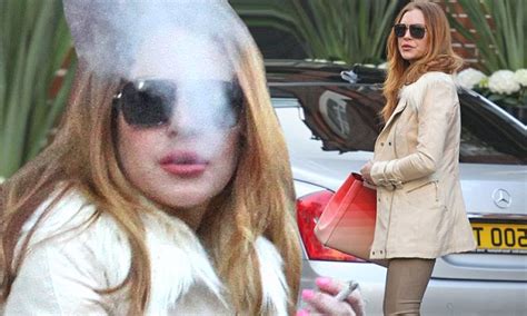 Lindsay Lohan Puffs On Cigarette In First Sighting Since Hospital Stay