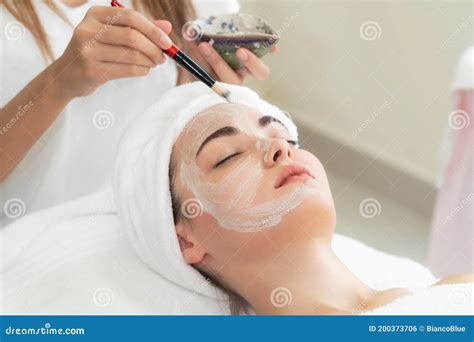 Beautiful Woman Having A Facial Treatment At Spa Stock Photo Image