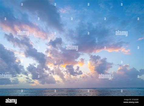 Beautiful Pink And Orange Clouds At Sunrise Over The Caribbean Sea