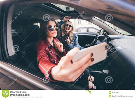 Group Of Girls Having Fun With The Car Taking Selfie While Driving In Trip Stock Image Image