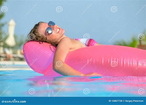 Young Woman Is Swimming On Pink Air Bed Stock Photo Image Of Hand