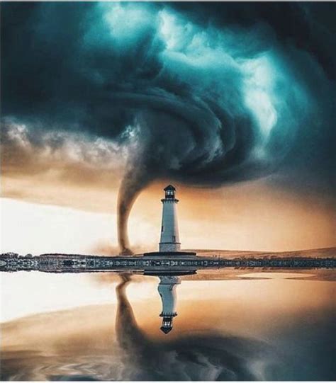 A Lighthouse In The Middle Of A Body Of Water With A Storm Coming From It