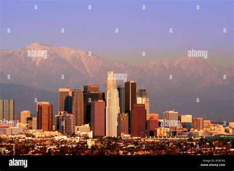 Los Angeles Skyline And Snow Covered San Bernardino Mountains Stock
