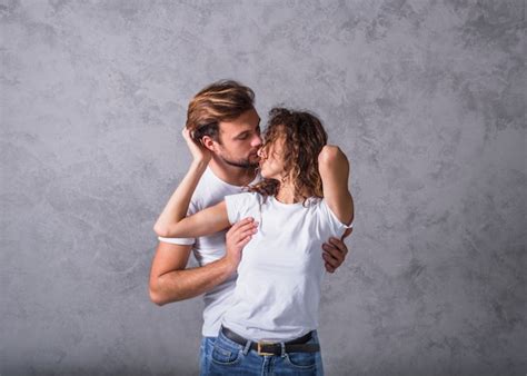 Free Photo Young Man Hugging Woman From Behind