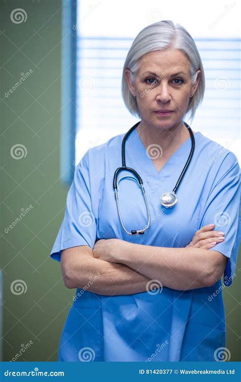 Portrait Of Nurse Standing With Arms Crossed Stock Image Image Of