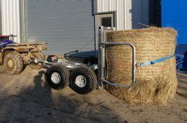ATV Bale Trailer Holding A Round Bale Of Hay ATV Single Axle Bale