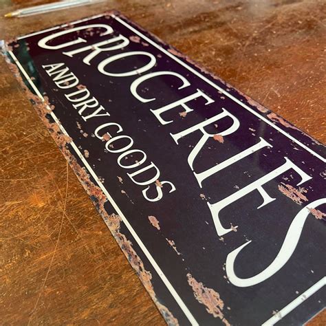 Groceries And Dry Good Distressed Metal Vintage Wall Sign