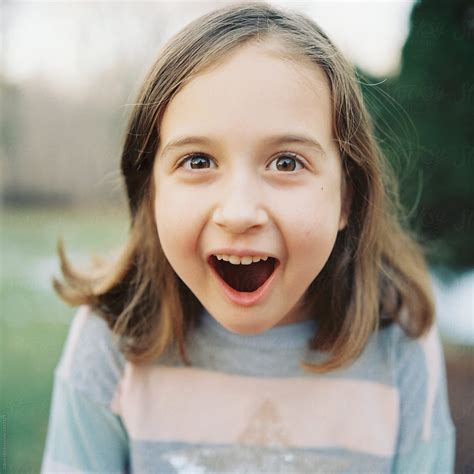 Close Up Portrait Of A Young Girl Looking Surprised By Stocksy