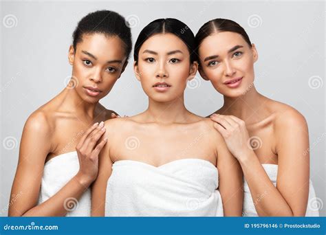 Three Sensual Models Girls Posing Naked Over White Studio Background