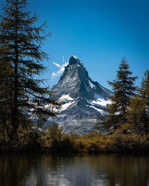 Beautiful View Of The Famous Riffelsee Lake In Snow Capped Matterhorn