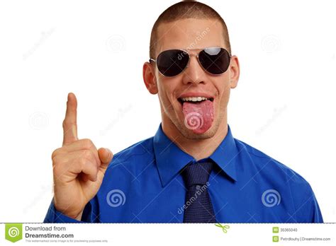 Young Man At Sunglasses Sticking Tongue Out Stock Photo