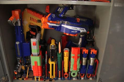 We made this nerf gun cabinet with 2 ikea besta shelf frames. Nerf Gun Storage Cabinet : Nerf Storage Ideas A Girl And A ...