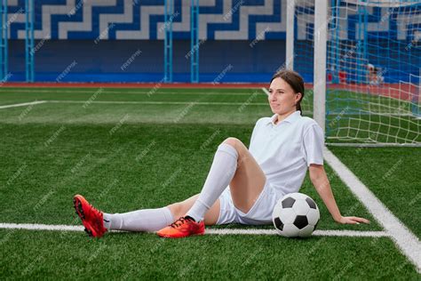 Premium Photo Sports Girl Football Player With A Soccer Ball On The