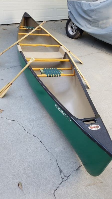Used Old Town Penobscot 17canoe With Paddles Life Vestand