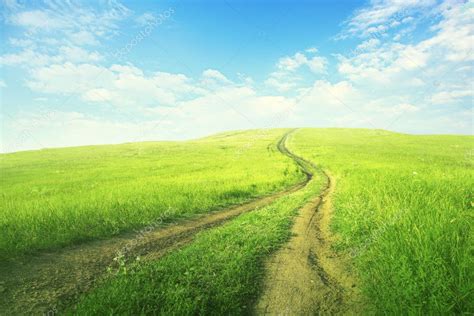 Summer Landscape With Green Grass Road And Clouds — Stock Photo