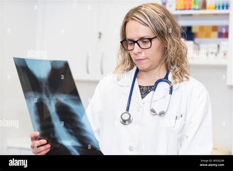 Female Doctor Examining A Radiography Stock Photo Alamy