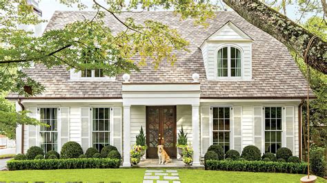 A traditional ranch home has at least one flower garden in the front yard. Classic Colonial Cottage - Charming Home Exteriors ...