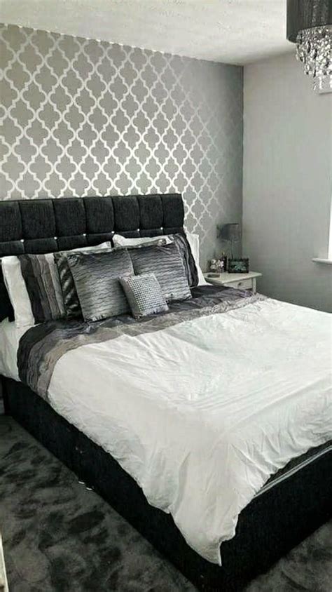 This beautiful wallpaper has a modern geometric design with a pink and grey triangles and is finished with metallic highlights. Camden Trellis Wallpaper Soft Grey Silver | Feature wall bedroom, Wallpaper bedroom feature wall ...