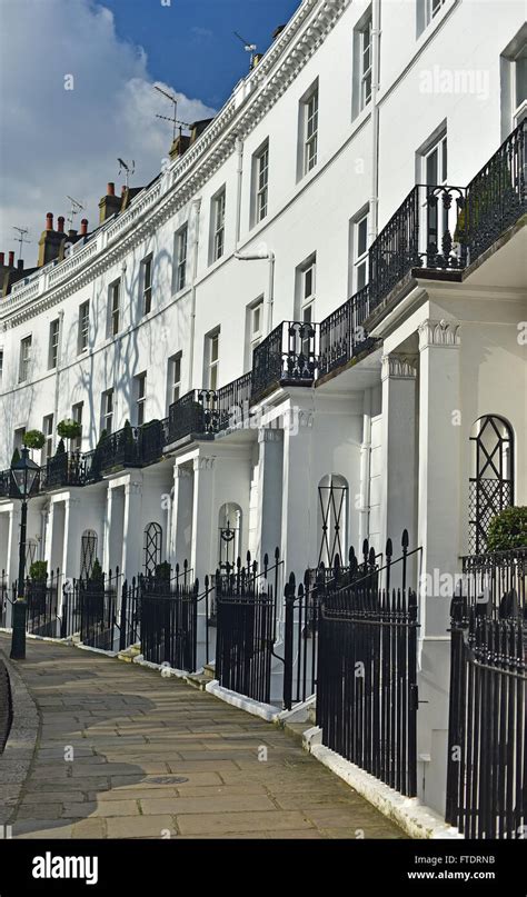 Gleaming White Townhouses On A Chelsea London Residential Crescent