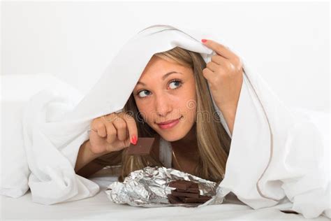 Woman Eating Chocolate In Bed Stock Image Image Of Portrait Sweet