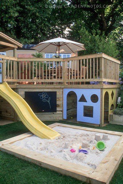 Playhouse Built Under Deck With Slide Into Sandbox How Awesome Is That