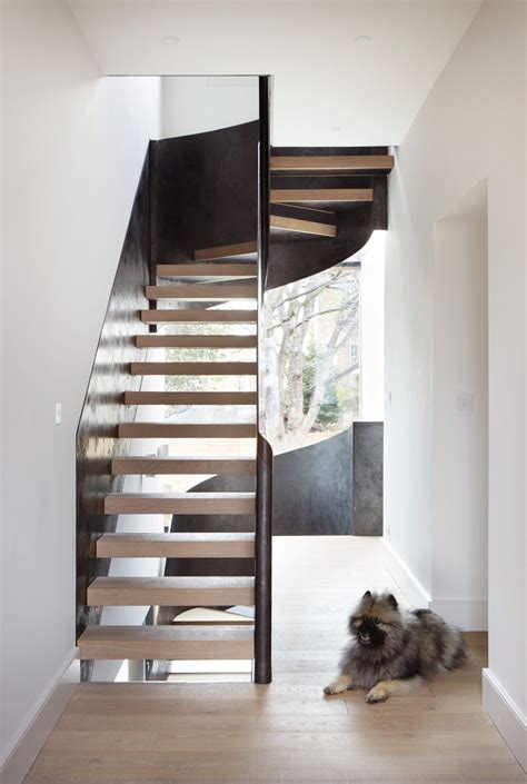Steel Wrapped Staircase Winds Through Cousins And Cousins Laminated