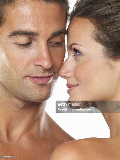 Studio Portrait Of Young Attractive Couple Looking At Each Other High