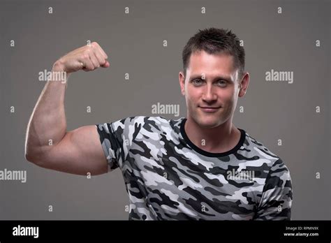 Blue T Shirt Flexing Biceps Hi Res Stock Photography And Images Alamy