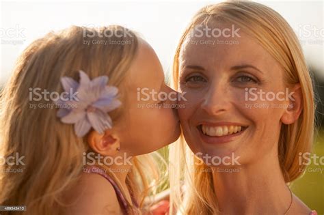 Daughter Kissing Her Mother Stock Photo Download Image Now 2015 30