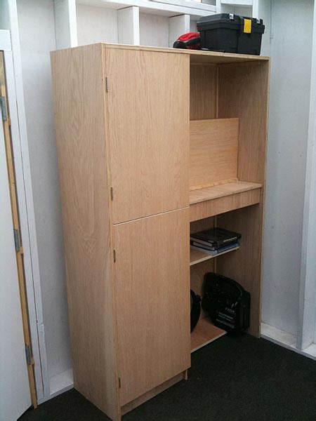 Now, flip the cabinet over on its face and attach the 1/4″ hardwood plywood to the back with 3/4″ staples and wood glue. Plywood Storage Cabinets Plans, Diy Wood Burner
