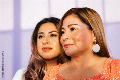 Portrait Of Latina Mother And Daughter In Studio Environment Stock