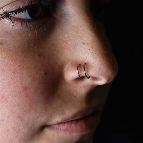 Double Nostril Piercings Have Been All The Rage Recently Check Out This Well Healed Stack With
