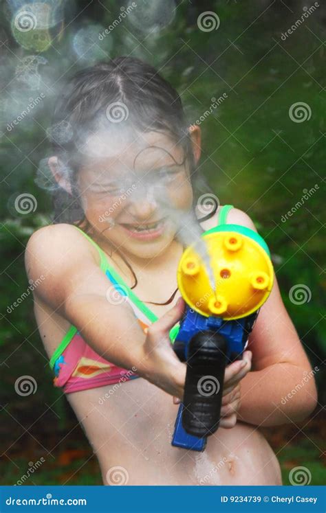 Girl With Squirt Gun Stock Image Image Of Colorful Squirt 9234739