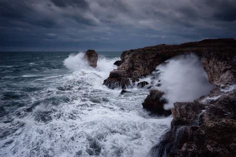 Dramatic Nature Background Big Waves And Dark Rock In Stormy Sea