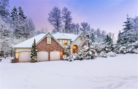 Driveway View Of Snowy Home Daylight Fades Over A Snow Covered