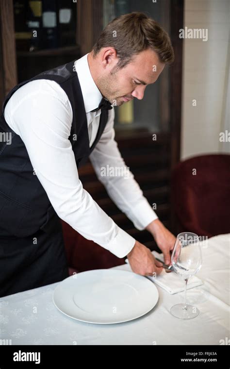 Handsome Waiter Setting The Table Stock Photo Alamy