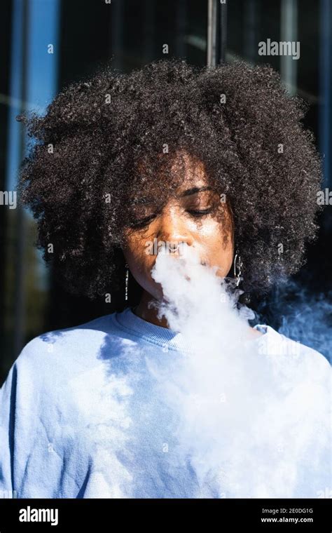 Woman Smoking Cigarette Exhaling Tobacco High Resolution Stock