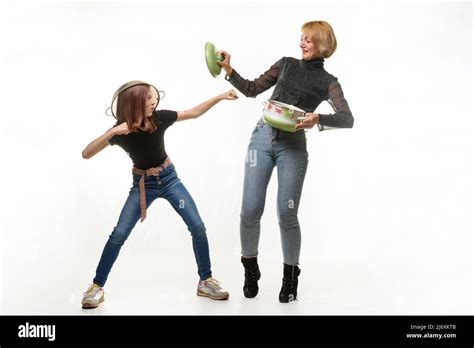 Mom And Daughter Have Fun Using Kitchen Utensils The Girl Attacks Mom Defends Herself With A