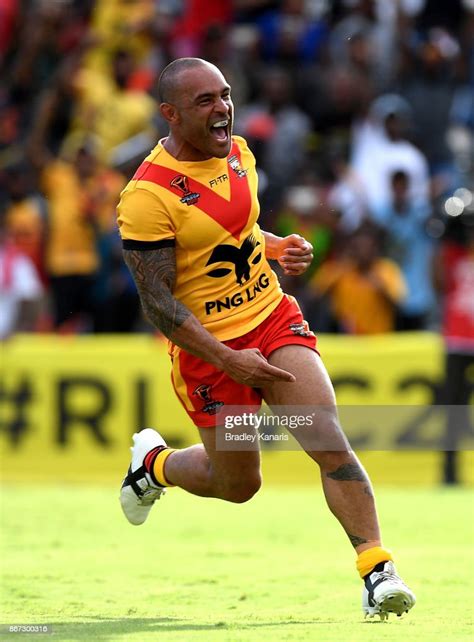 Paul Aiton Of Papua New Guinea Celebrates Scoring A Try During The