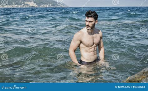 Young Man Standing On A Beach Alone Stock Image Image Of Body Person
