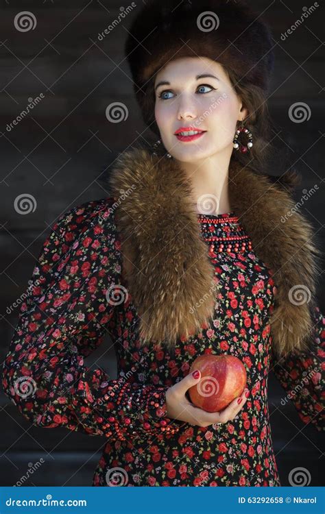 Portrait Of Russian Fashion Style Woman With Red Apple In Arm Stock