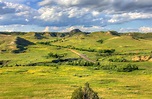 Landscapes of grasslands and hills at Theodore Roosevelt National Park ...